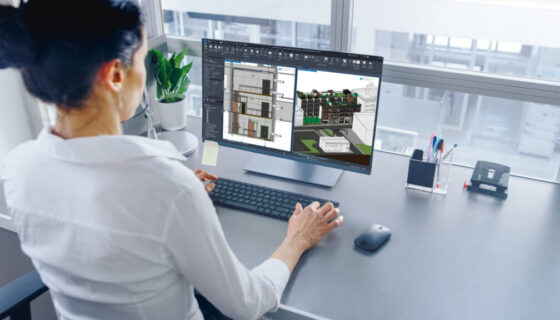 In Open Space Office Businesswoman Working on Her Personal compu